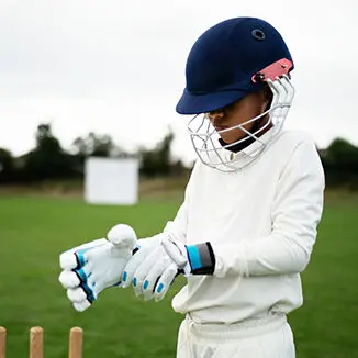 Kids playing cricket while developing resilience and mental strength at Nudge Sports